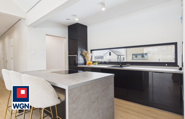 Dom jednorodzinny parterowy - projekt `Ekonomiczny 4T` , Gorzyca, gm. Lubin  
  
Ten dom łączy funkcjonalny projekt parterowy z