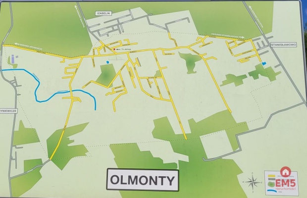 Działka budowlana wśród zieleni.