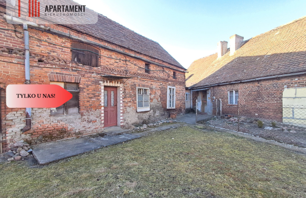 DZIAŁKA Z ZABUDOWANIAMI W CENTRUM OSIEKA NAD NOT.