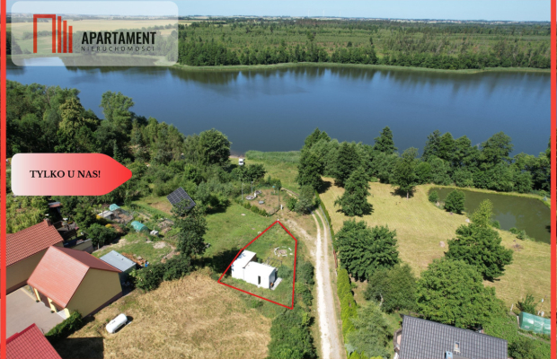 Działka nad jeziorem Raciąskim z domkiem.