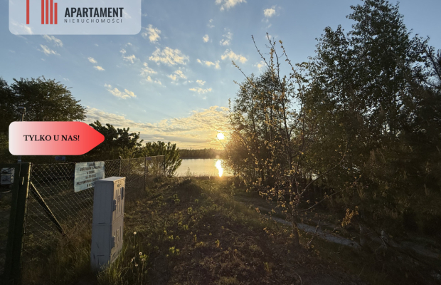 Działka nad jeziorem Raciąskim z domkiem.