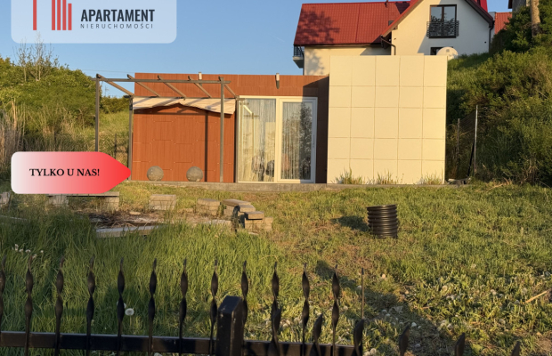 Działka nad jeziorem Raciąskim z domkiem.