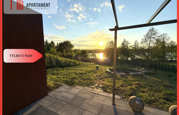 Działka nad jeziorem Raciąskim z domkiem.