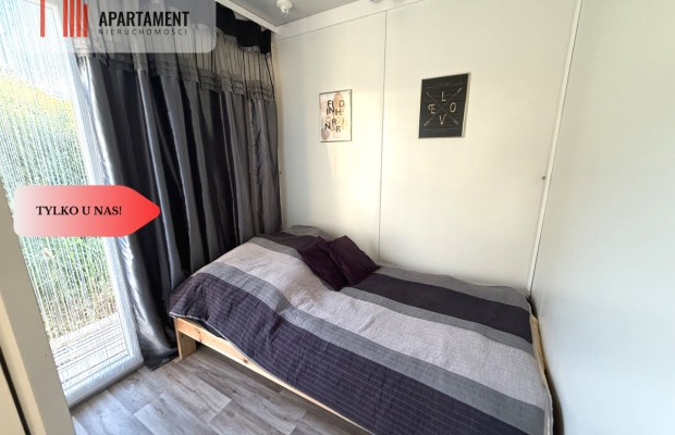 Działka nad jeziorem Raciąskim z domkiem.