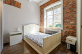 Dwupokojowy apartament z historycznym charakterem