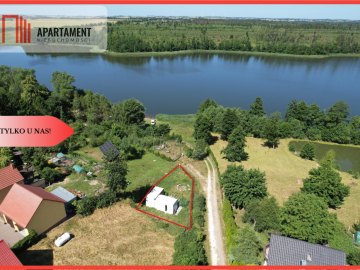 Działka nad jeziorem Raciąskim z domkiem.